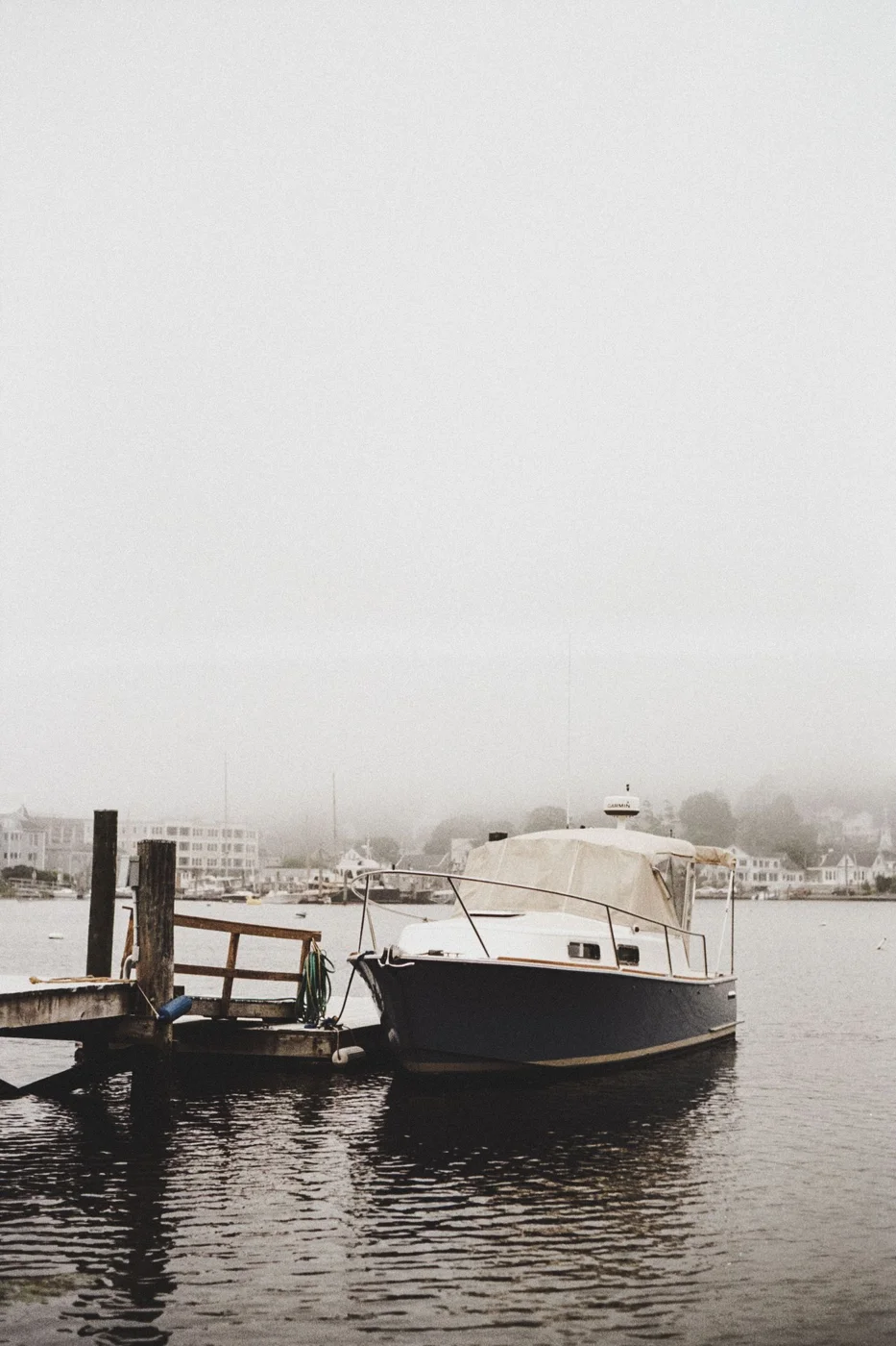A boat moored in the fog at Mystic Connecticut